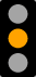 Picture of a traffic signal showing a yellow light